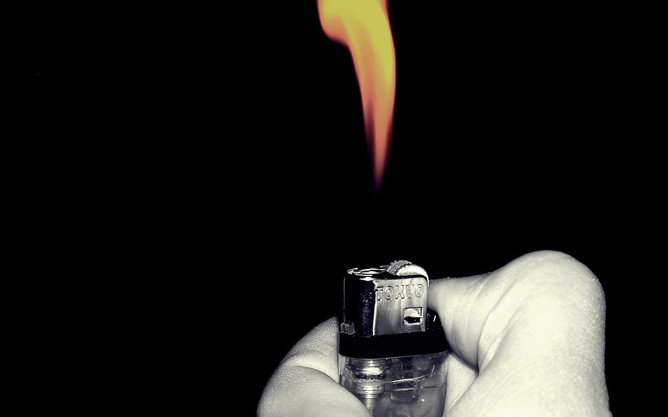 person holding lighter with fire HD wallpaper